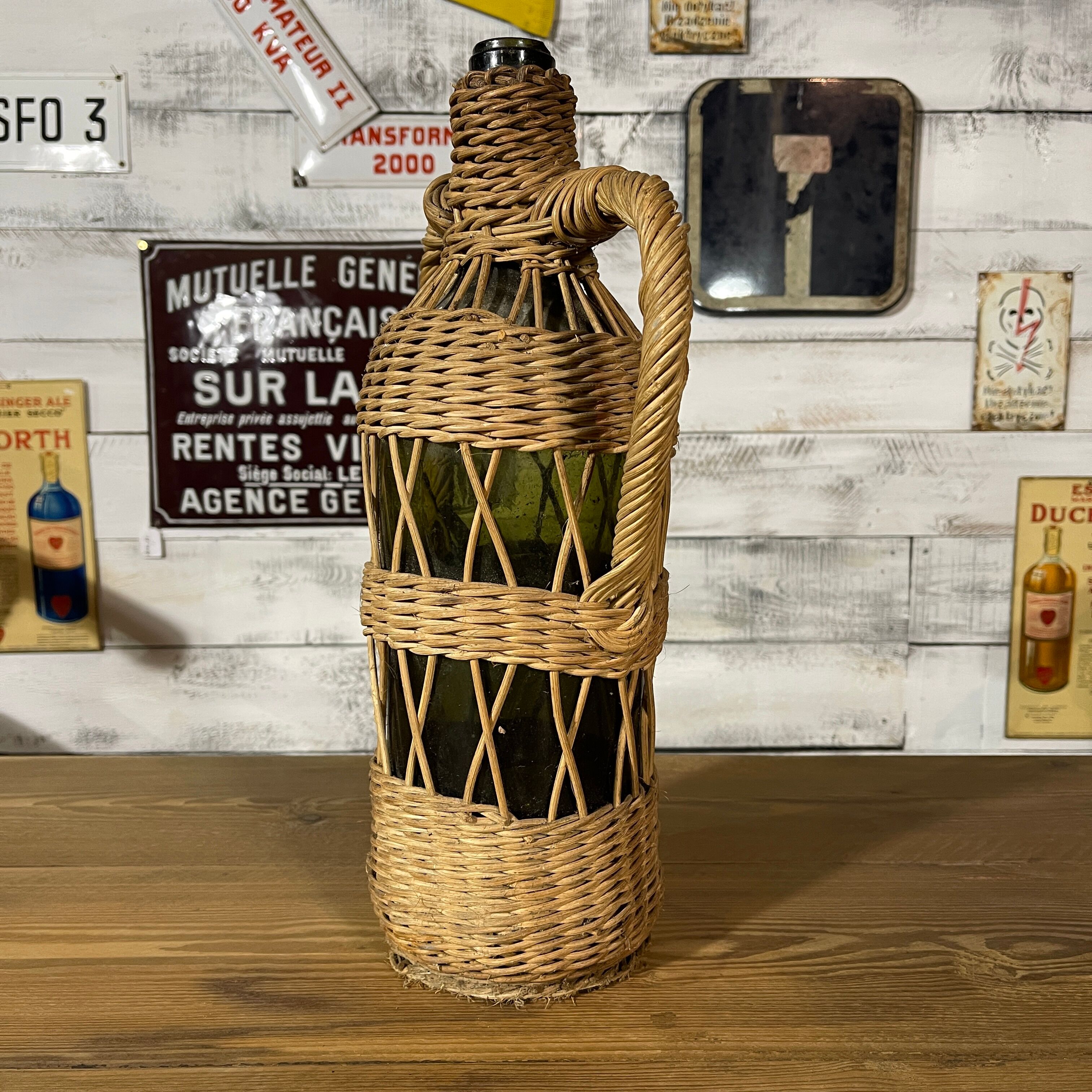 Braided wicker green bottle