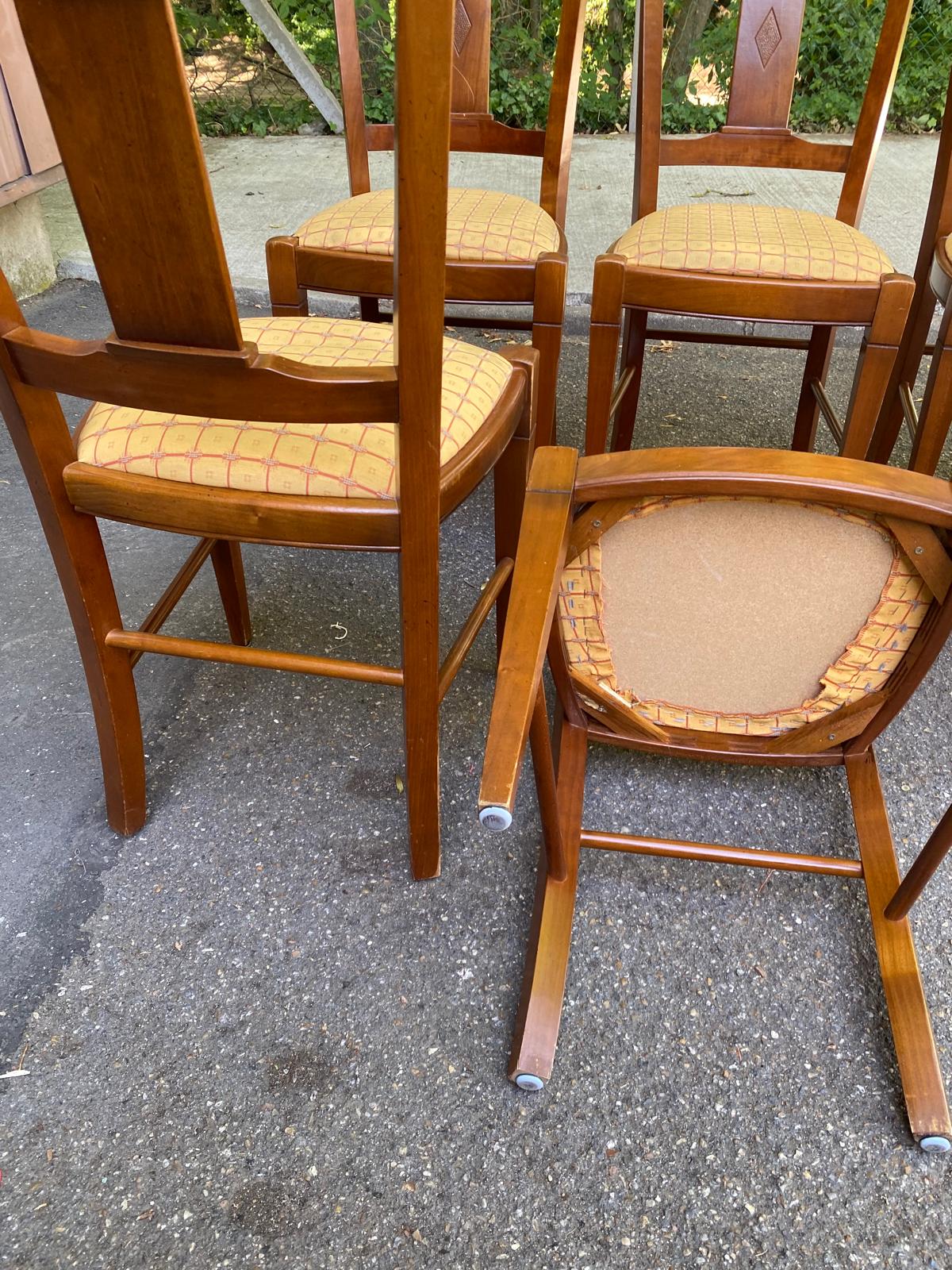 6 Syriel solid cherry wood dining chairs with yellow fabric.