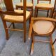 6 Syriel solid cherry wood dining chairs with yellow fabric.