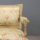 Antique neoclassical canapé in carved wood from the 19th century.