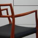 Vintage armchair in teak and black leather - Model 64 - Möller - Denmark '60's