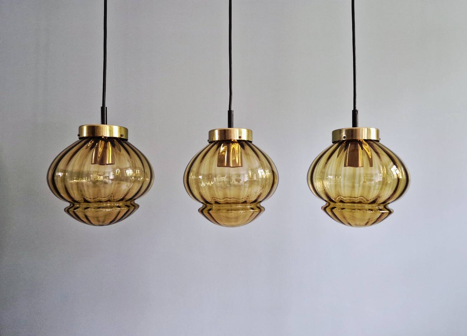 Set of 3 amber glass pendant lights, RAAK Amsterdam, 1970