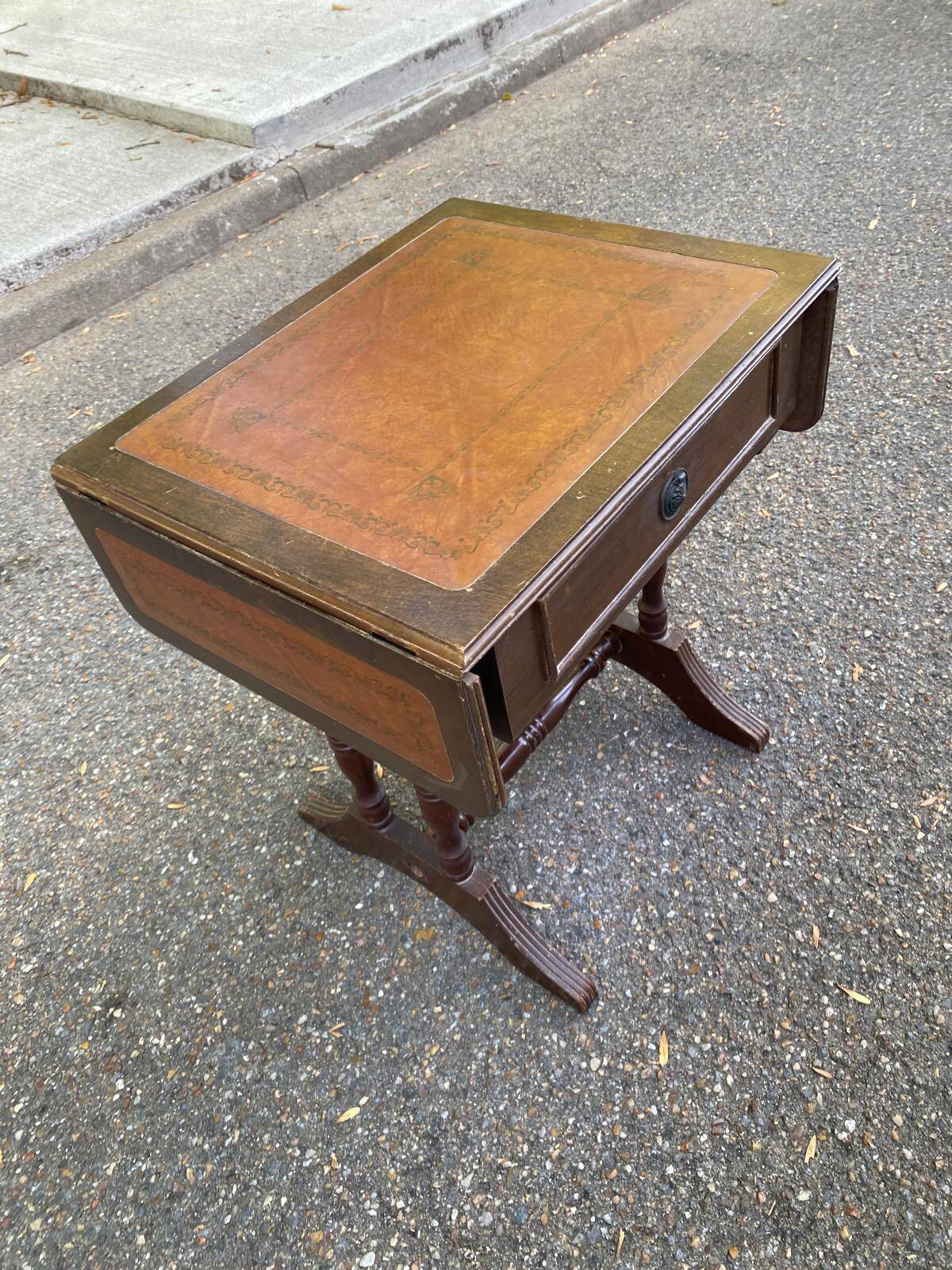 Small drop-leaf side table in English style with leather top & drawer.