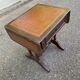 Small drop-leaf side table in English style with leather top & drawer.