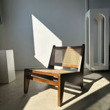 Reclined armchair in canned teak in natural wood