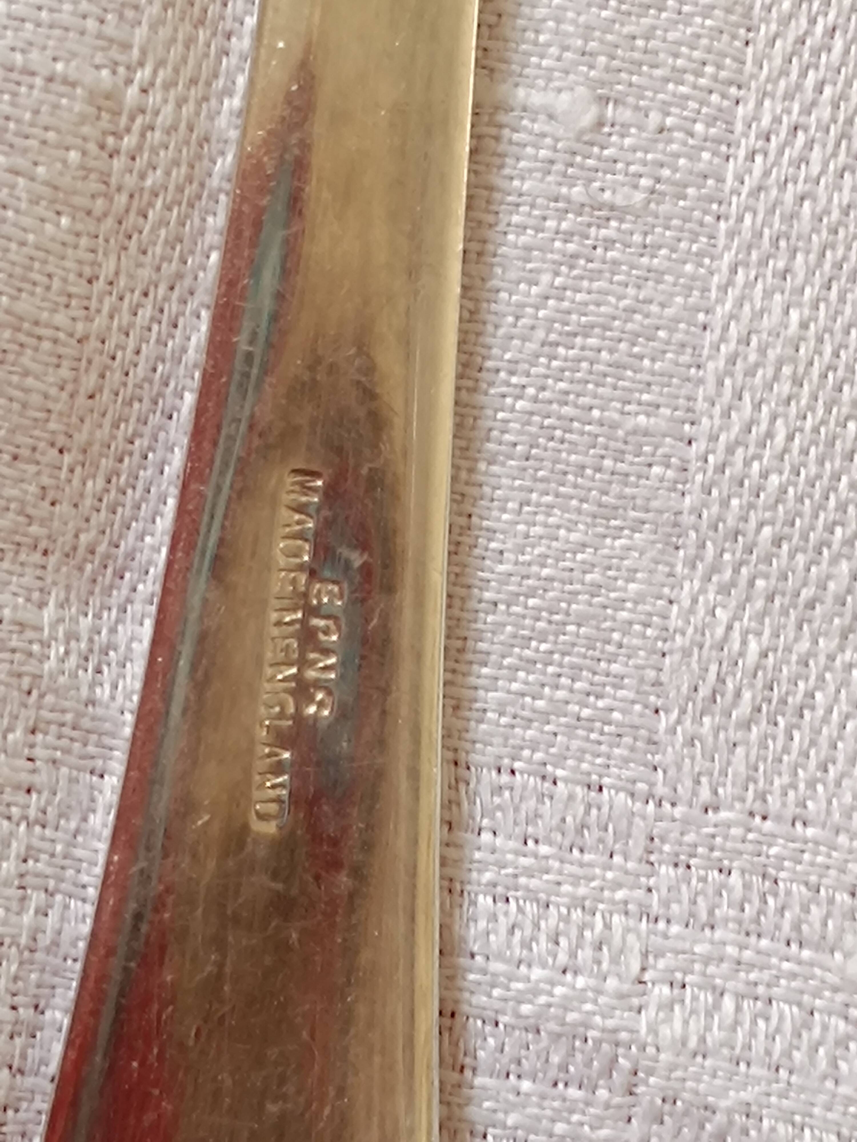 Eclassiqoe salad servers in English silver metal.