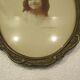 Old wall frame in carved wood and gilded stucco, oval