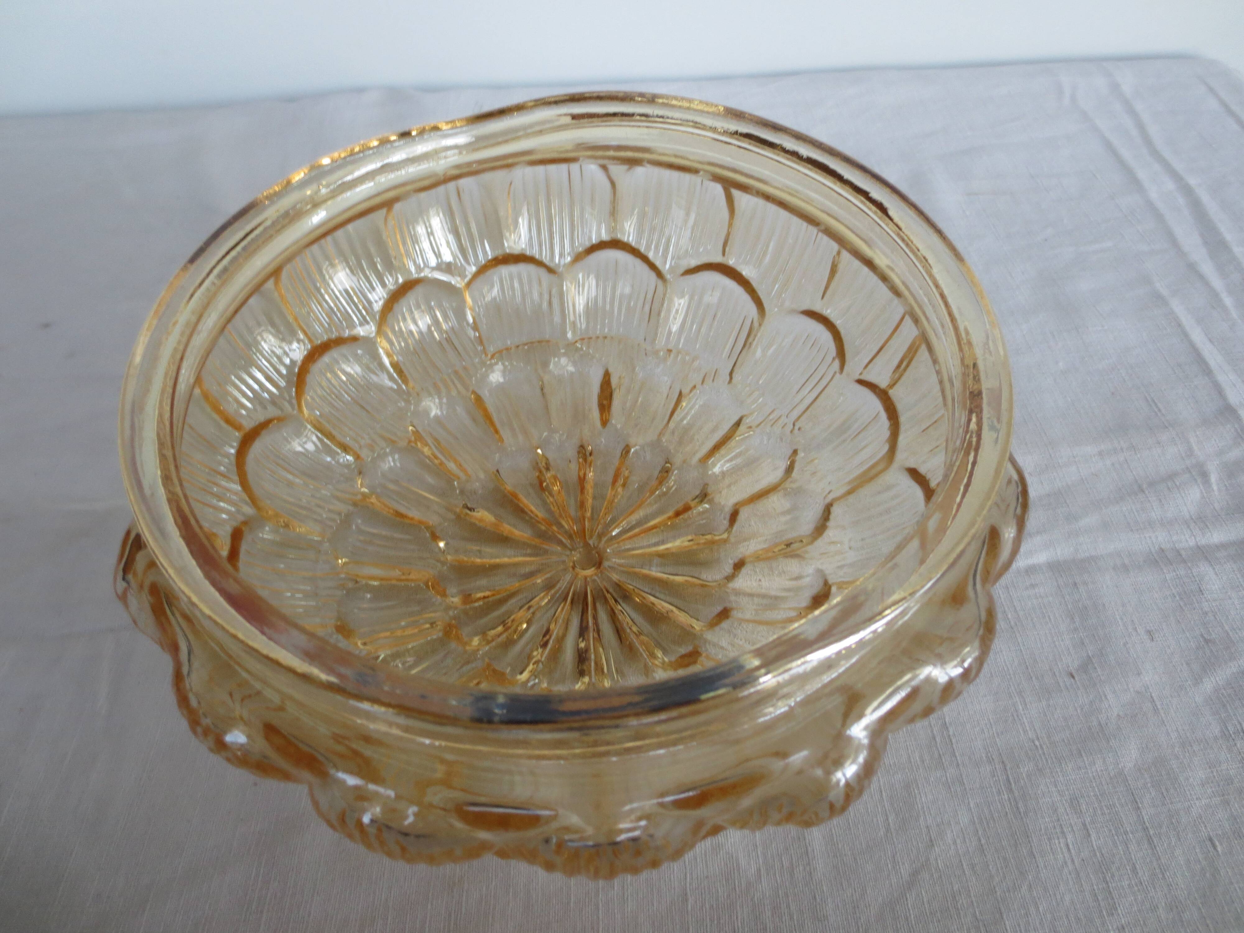 ceiling light with amber glass globe, on a round light wood base