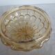ceiling light with amber glass globe, on a round light wood base