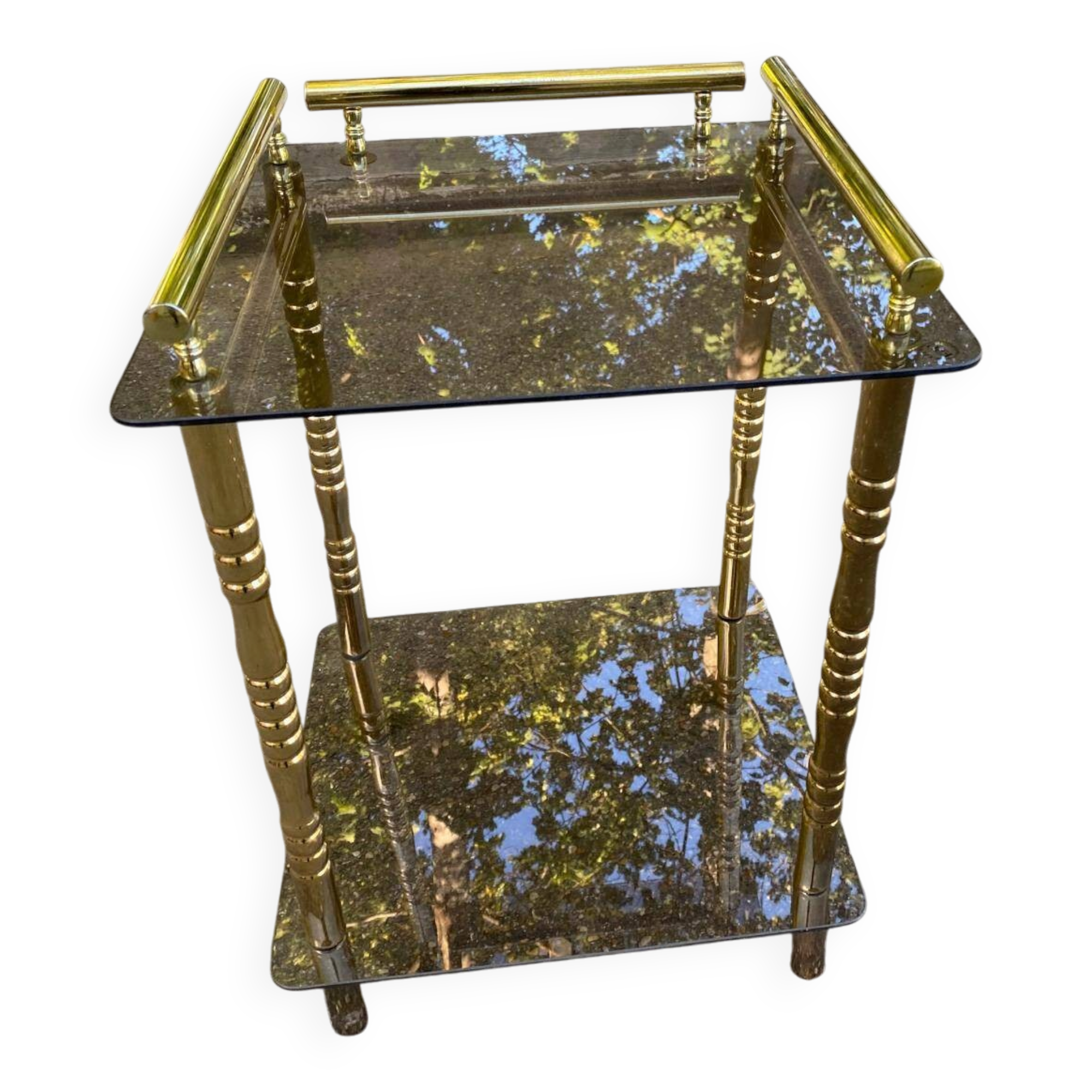 Vintage side table with smoked glass and sculpted golden brass, Hollywood Regency style.