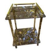 Vintage side table with smoked glass and sculpted golden brass, Hollywood Regency style.