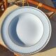 Twelve white porcelain plates
