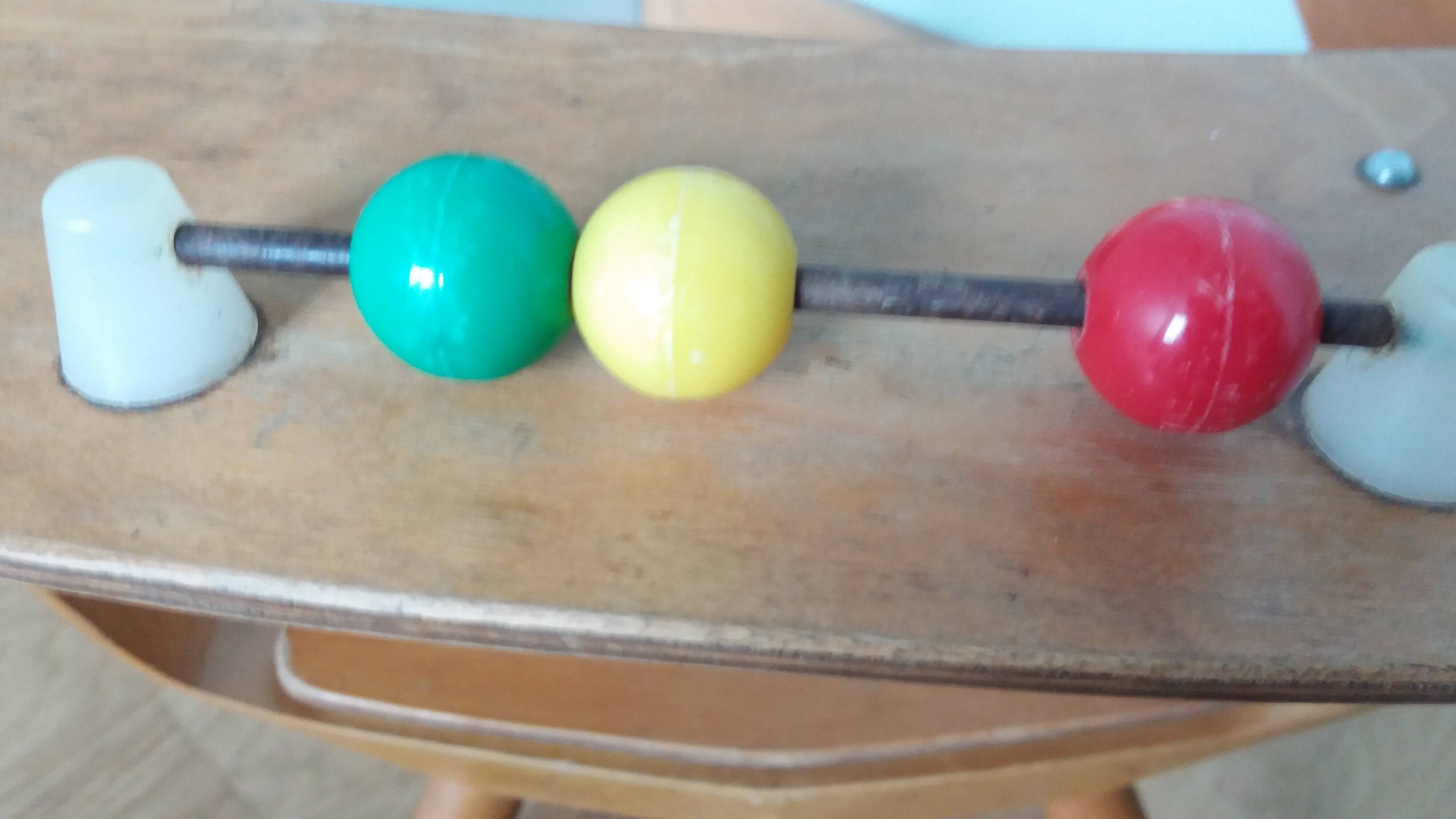 Baumann Baby Coquille children's armchair in bent wood with splayed legs.