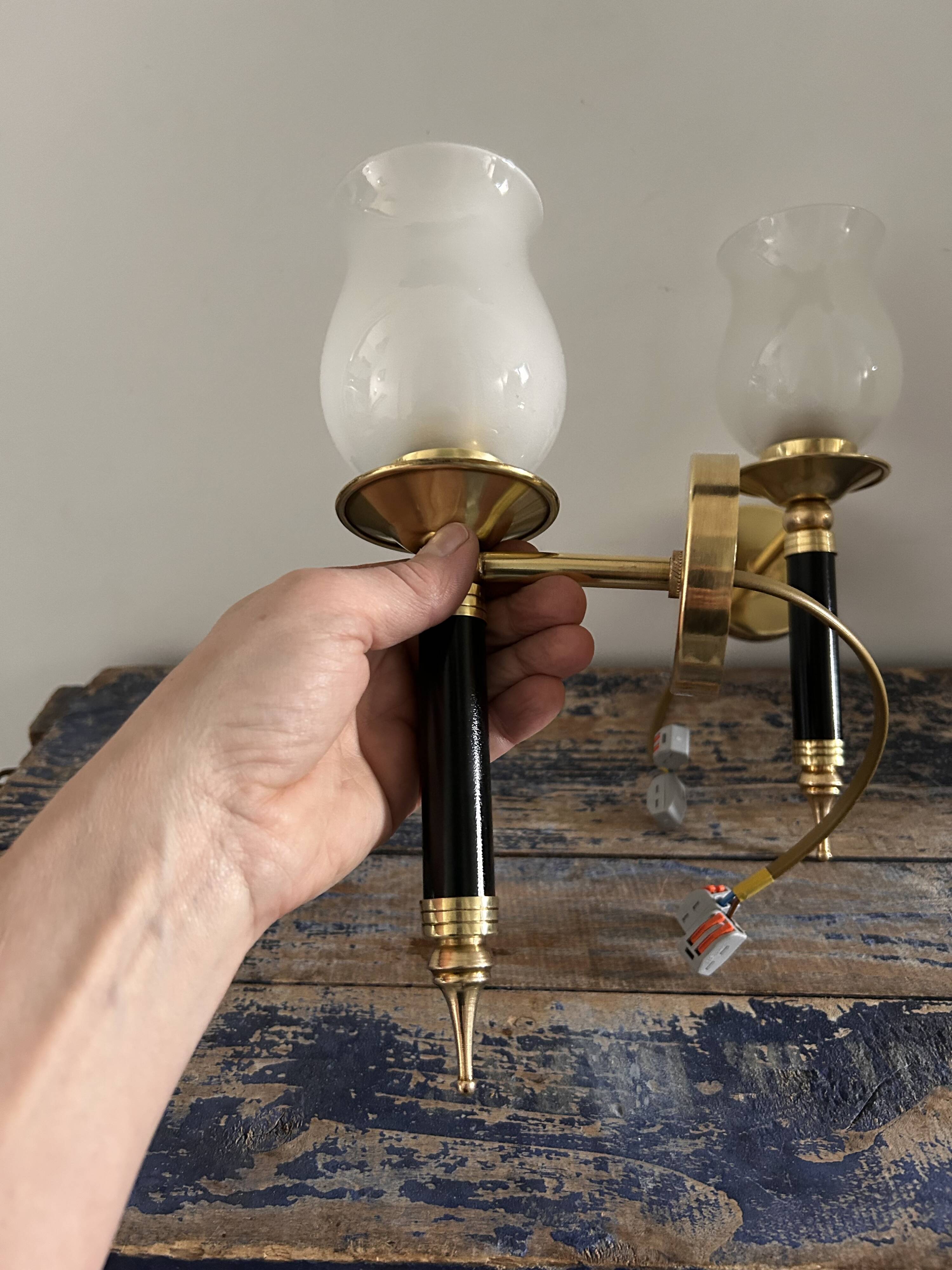 Pair of brass and black torchiere wall lights