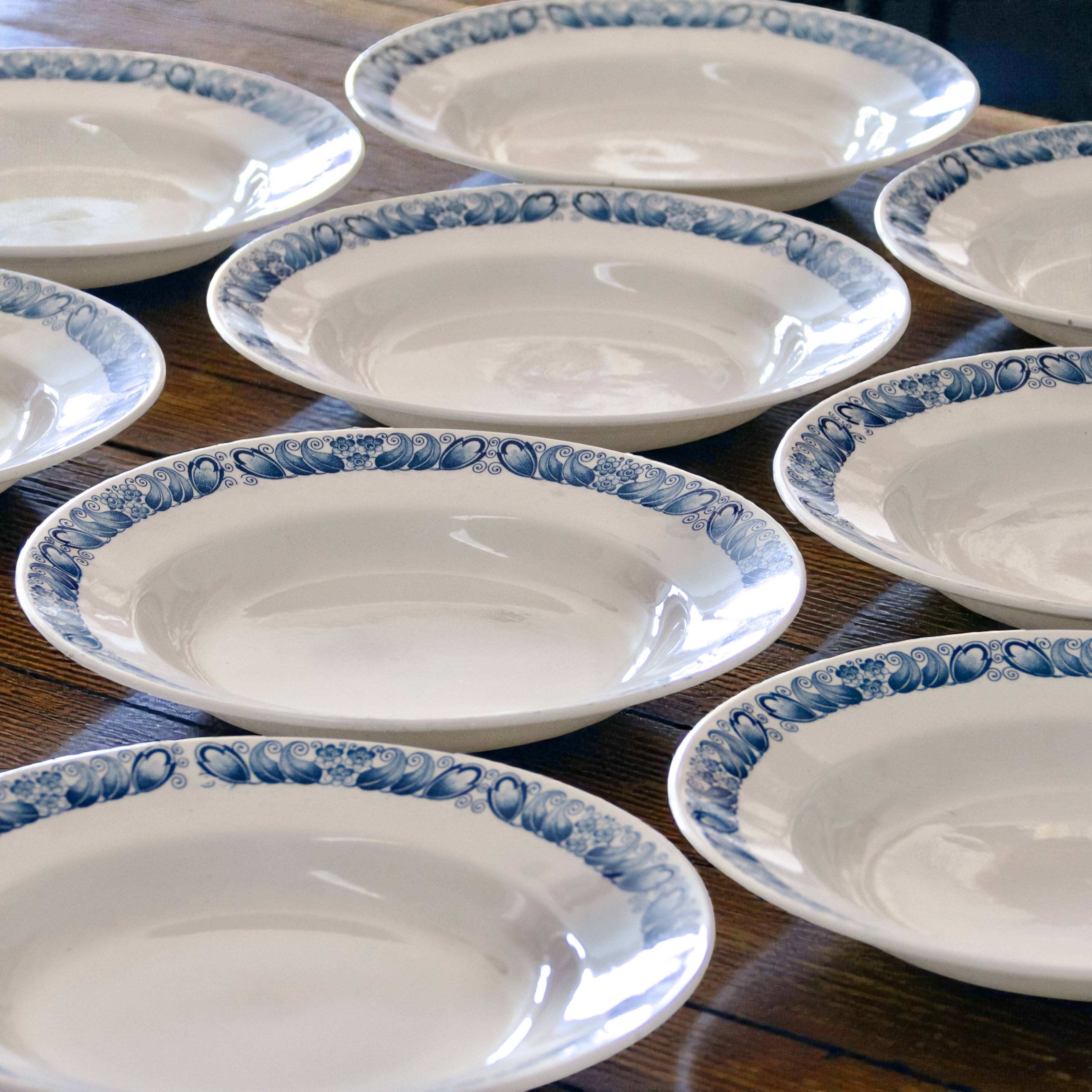 9 antique ironstone plates signed Longchamp "Marcel"