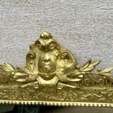 19th-century antique mirror in carved gilded wood, Napoleon style.