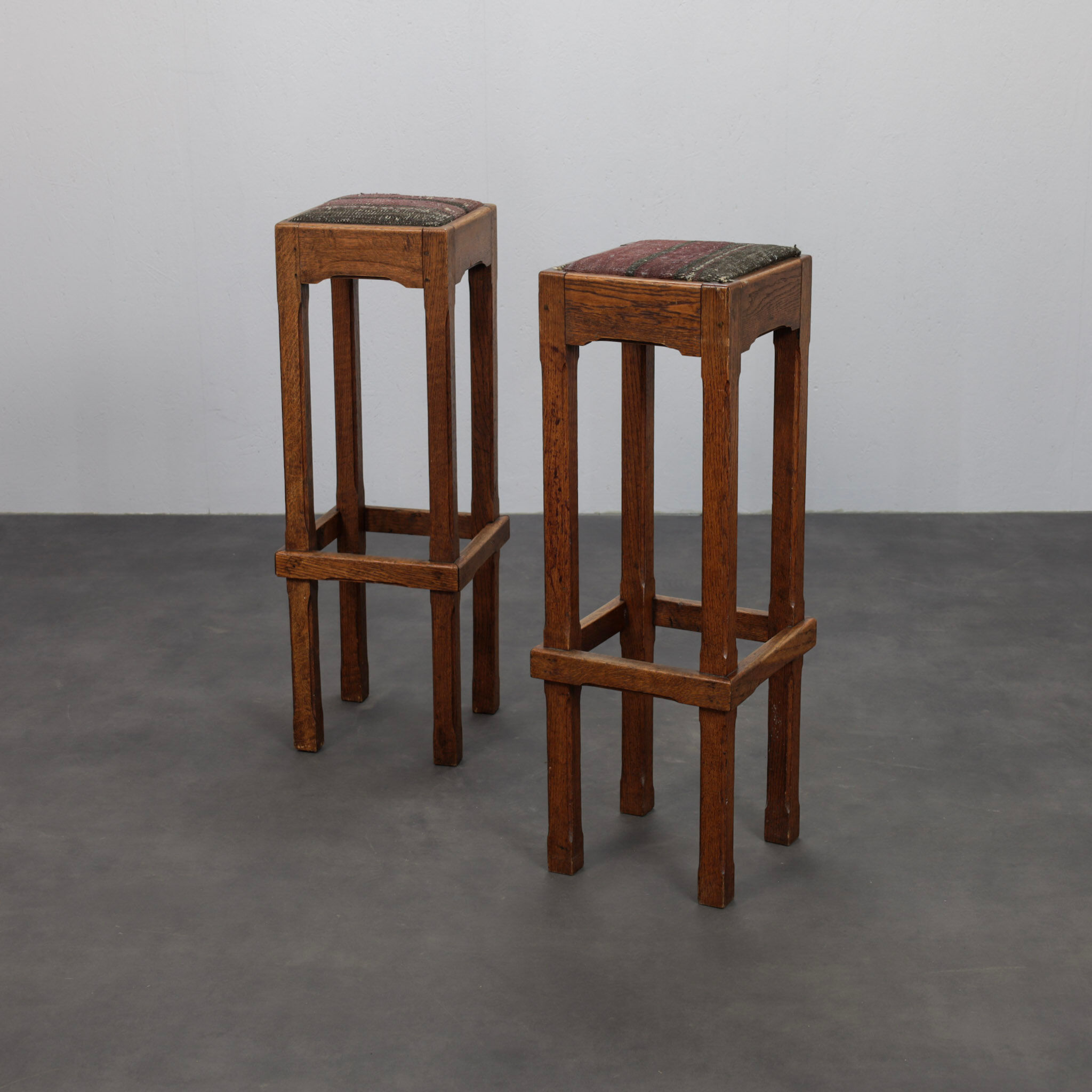 Pair of Dutch Art Deco oak bar stools with upholstered seats, 1930s