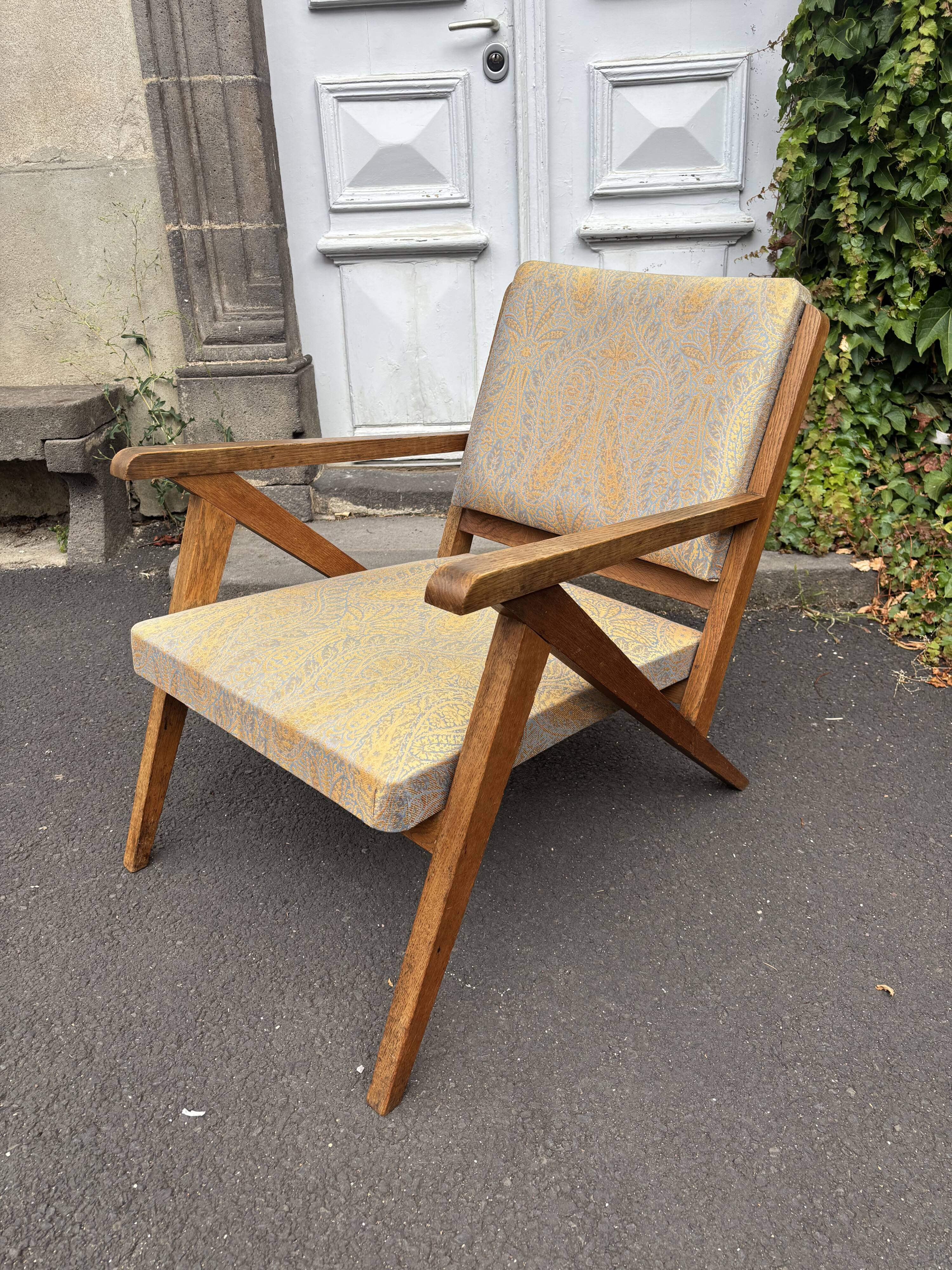 Vintage wooden armchair from the 1960s