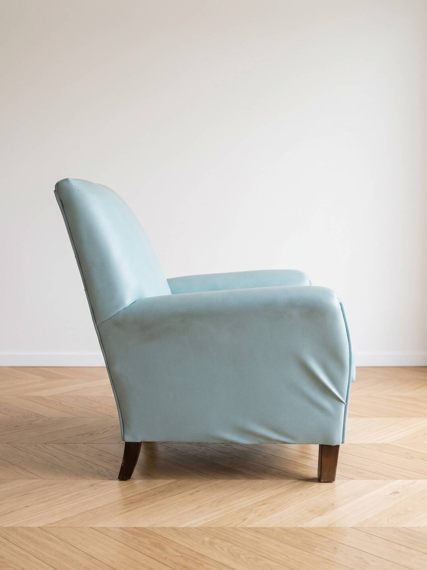 Vintage armchair in light blue faux leather retro style
