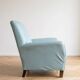 Vintage armchair in light blue faux leather retro style