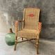 Vintage braided rattan armchair