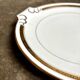 Round dish with ears in white and gold porcelain