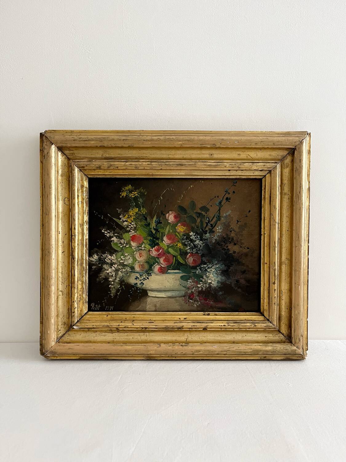 Old oil painting on wood of a bouquet of flowers signed Petit.