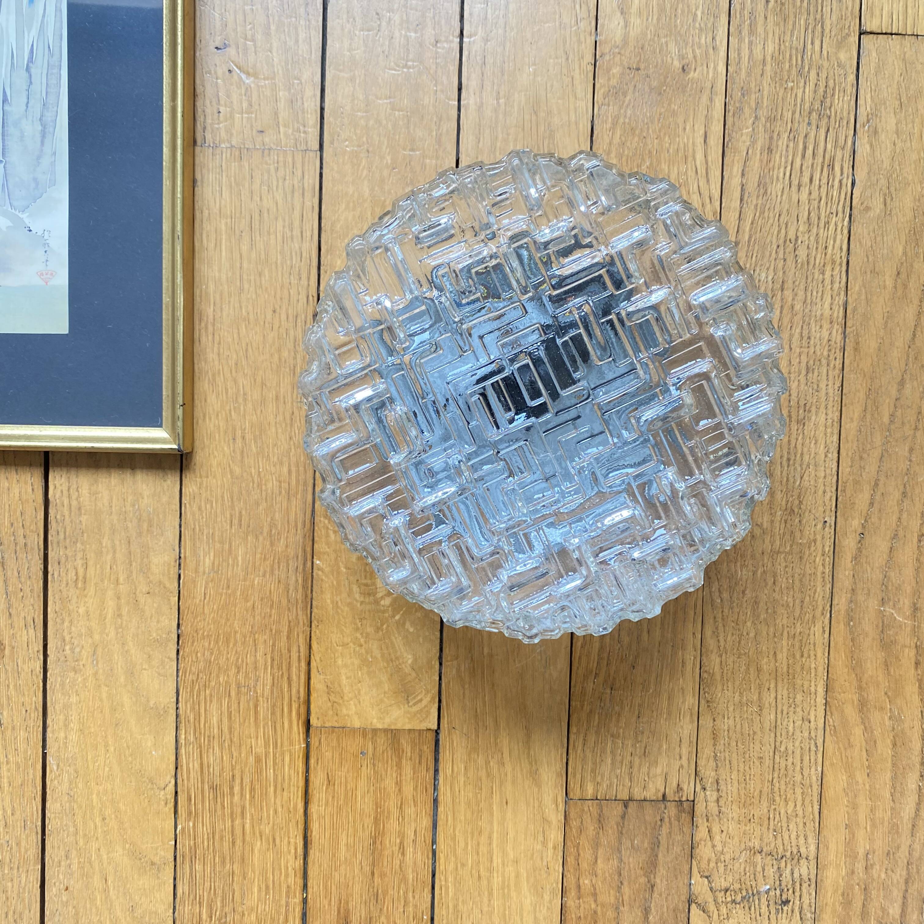 Wall lamp or ceiling light with minimalist porthole glass.