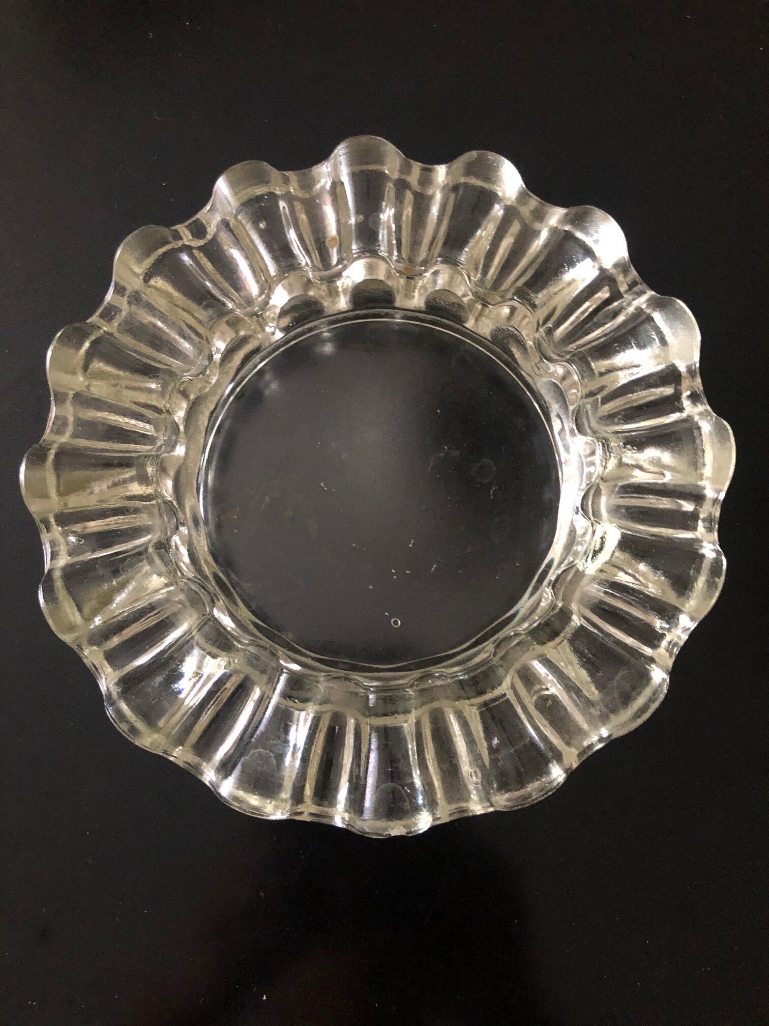 Curved glass ashtray