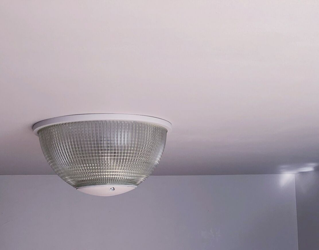 White Holophane wall light