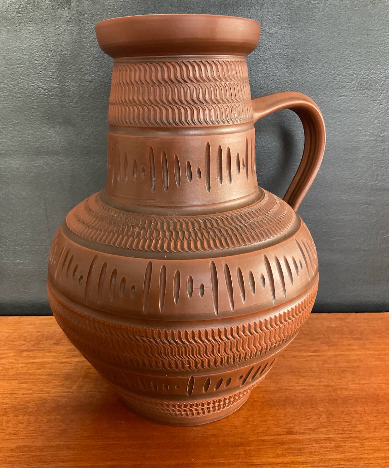 Trio of vintage vases in chiselled terracotta