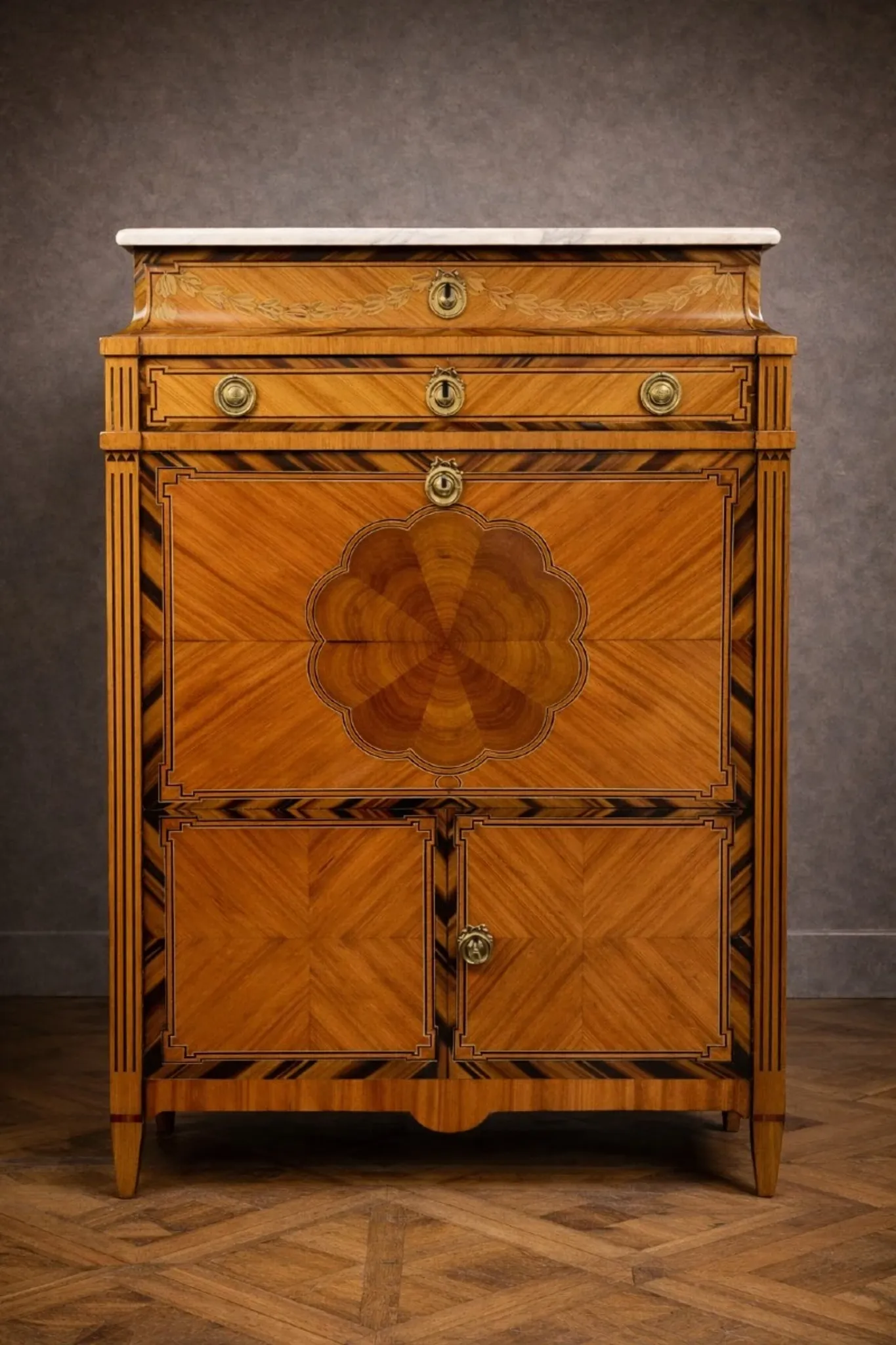 Secretary from the Louis XVI era in precious wood marquetry.