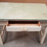 Old desk table with glass plate and drawer