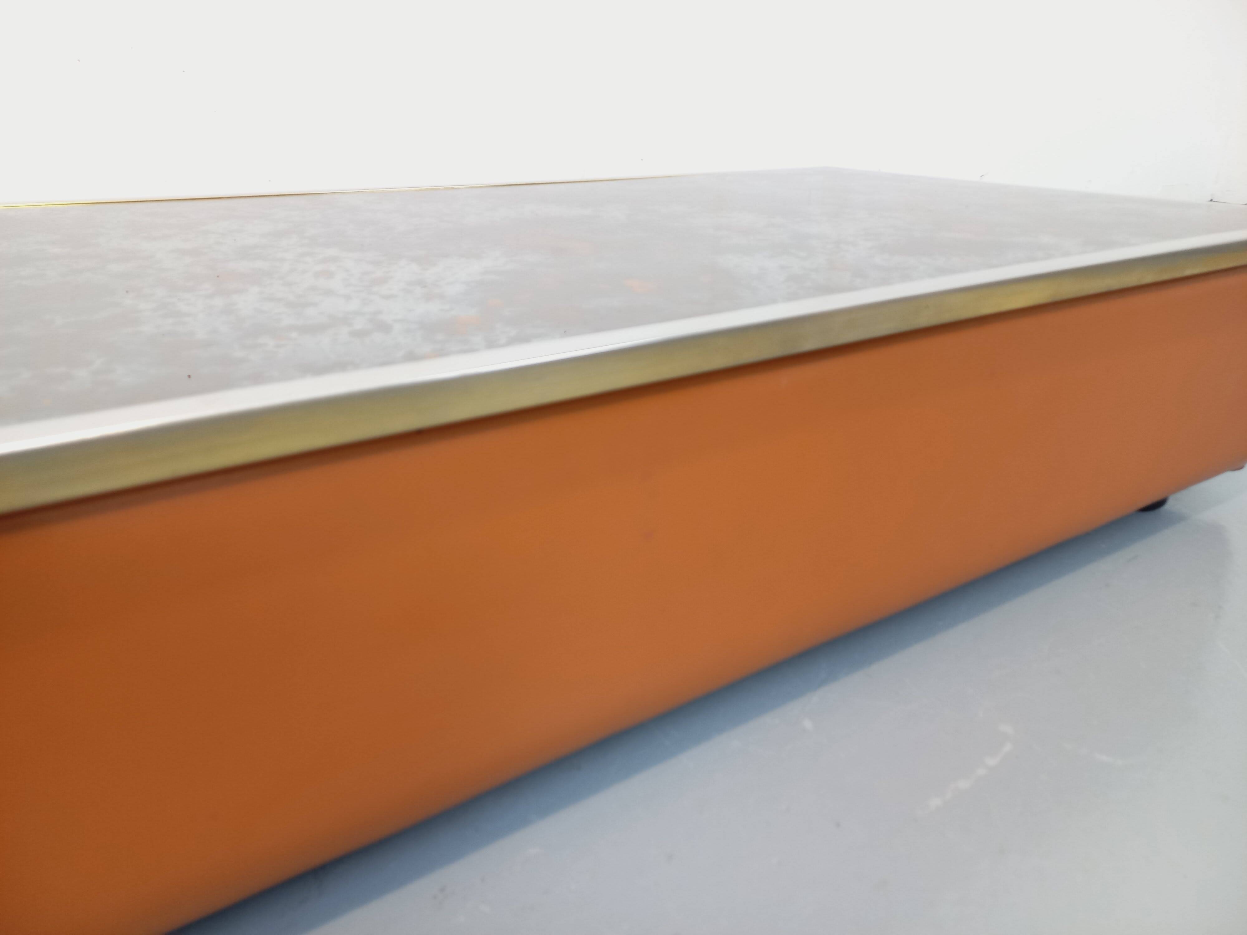 Vintage coffee table in églomisé glass, chrome and leather from the 70s