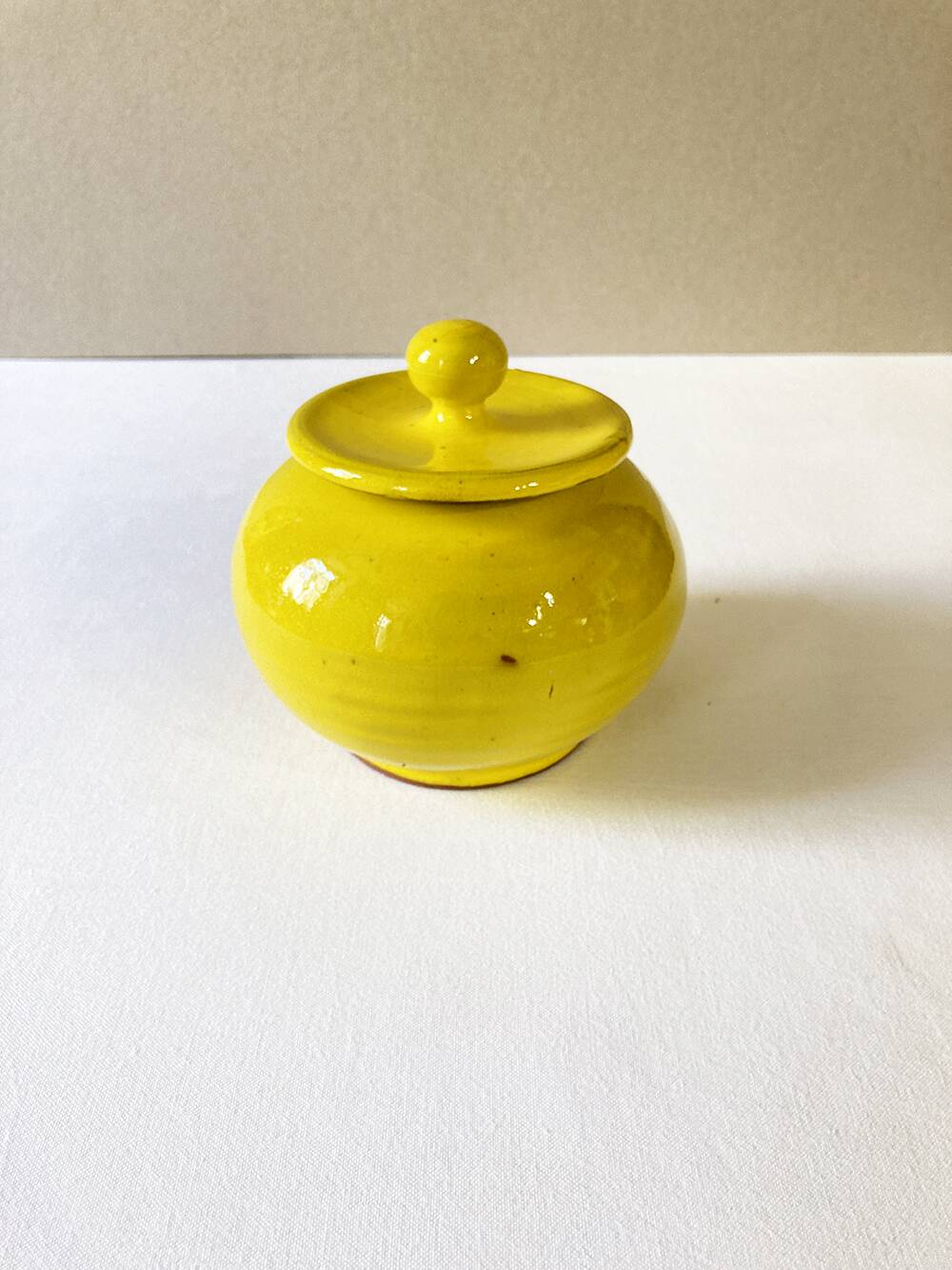 Yellow glazed ceramic sugar bowl