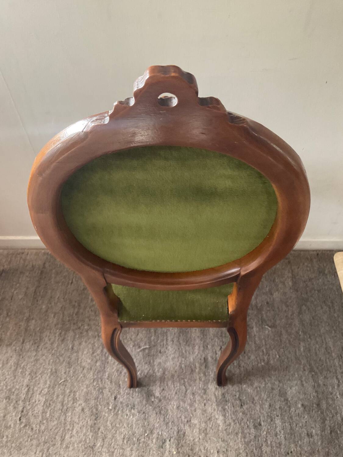 Antique wooden and velvet upholstered chair