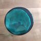 Blown glass vase with a flared neck and wavy rim.