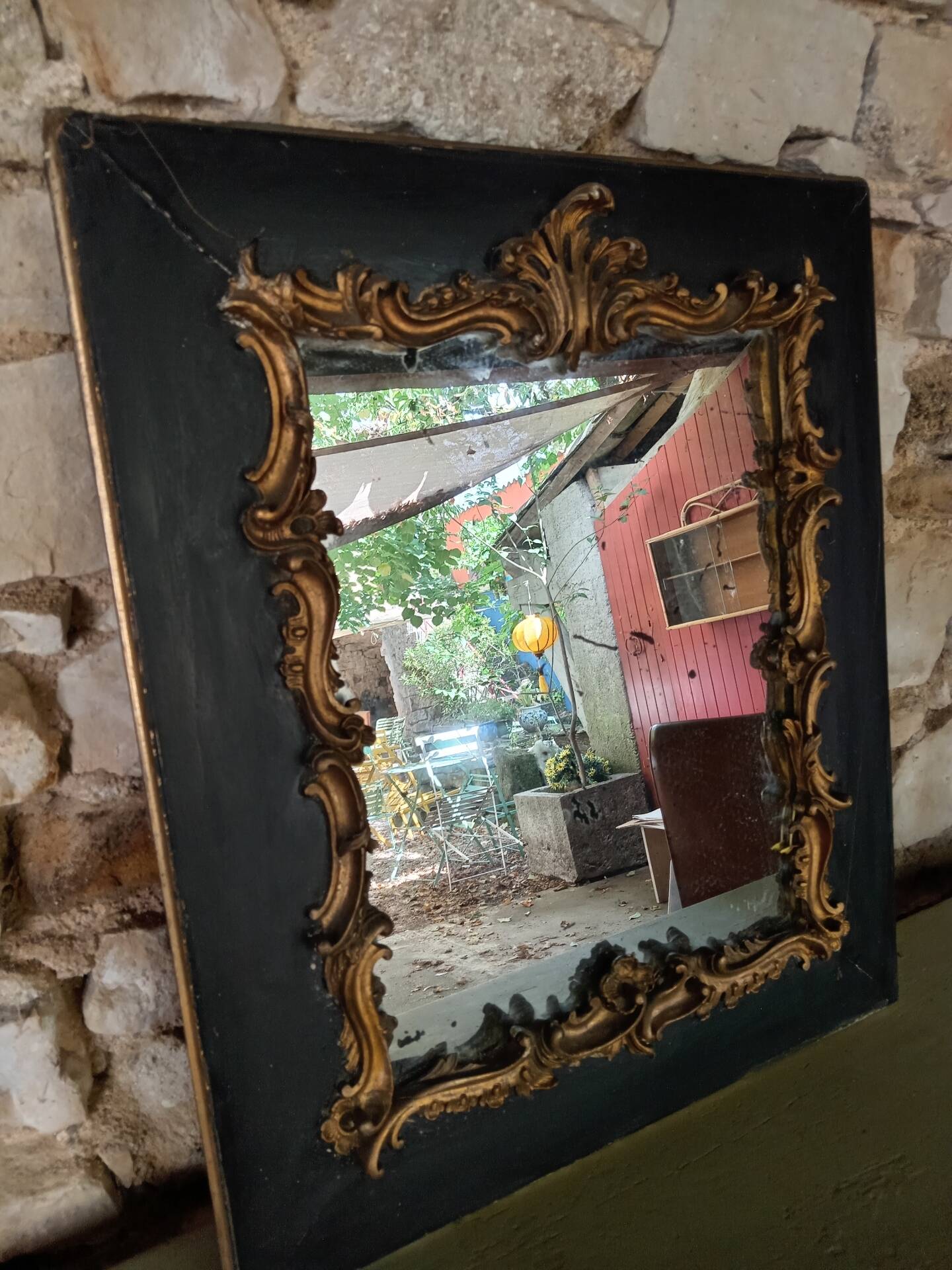 Antique mirror in stucco and wood