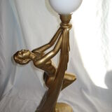 Lamp depicting a with a drape