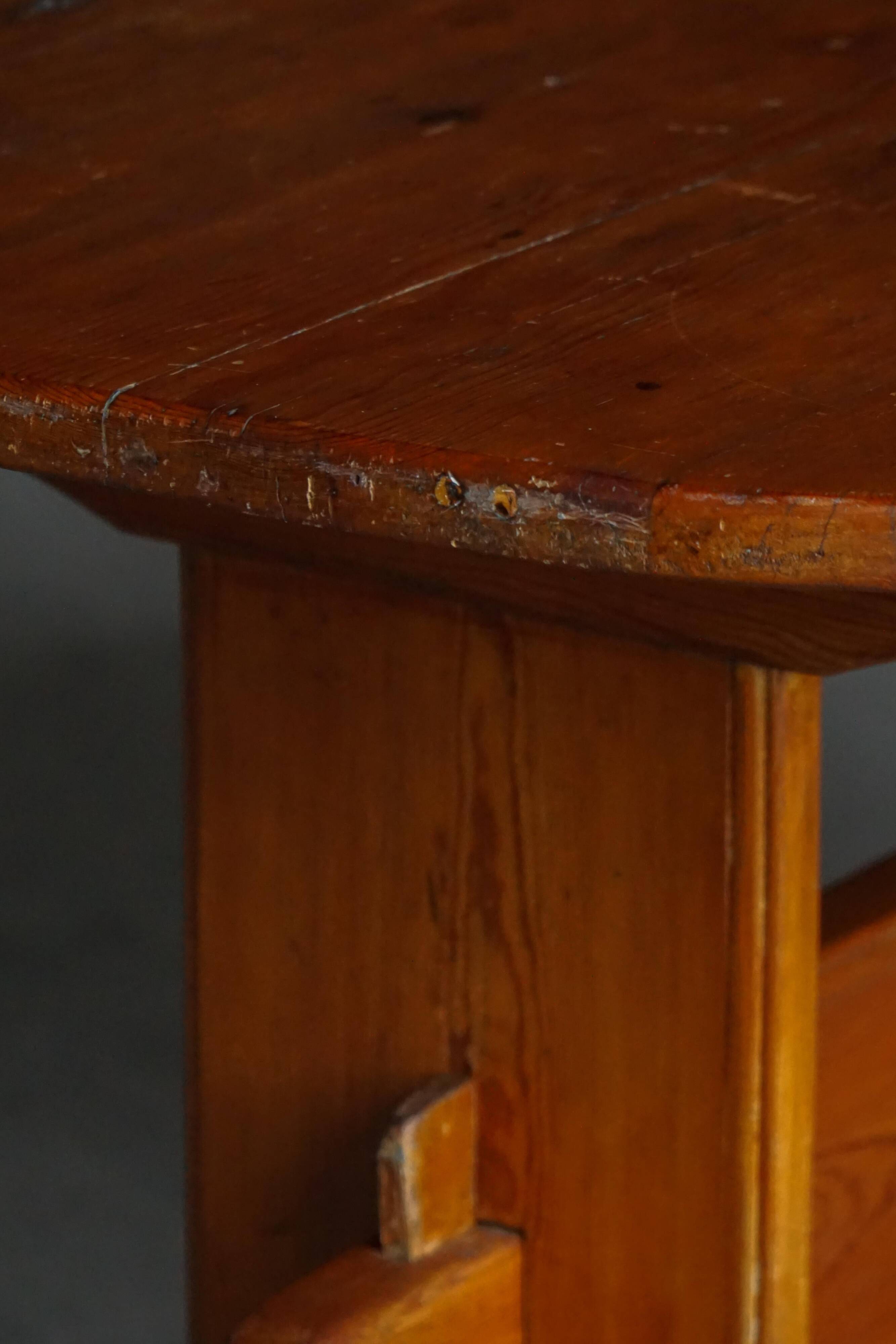 Primitive Swedish oval dining table in pine, early 20th century.