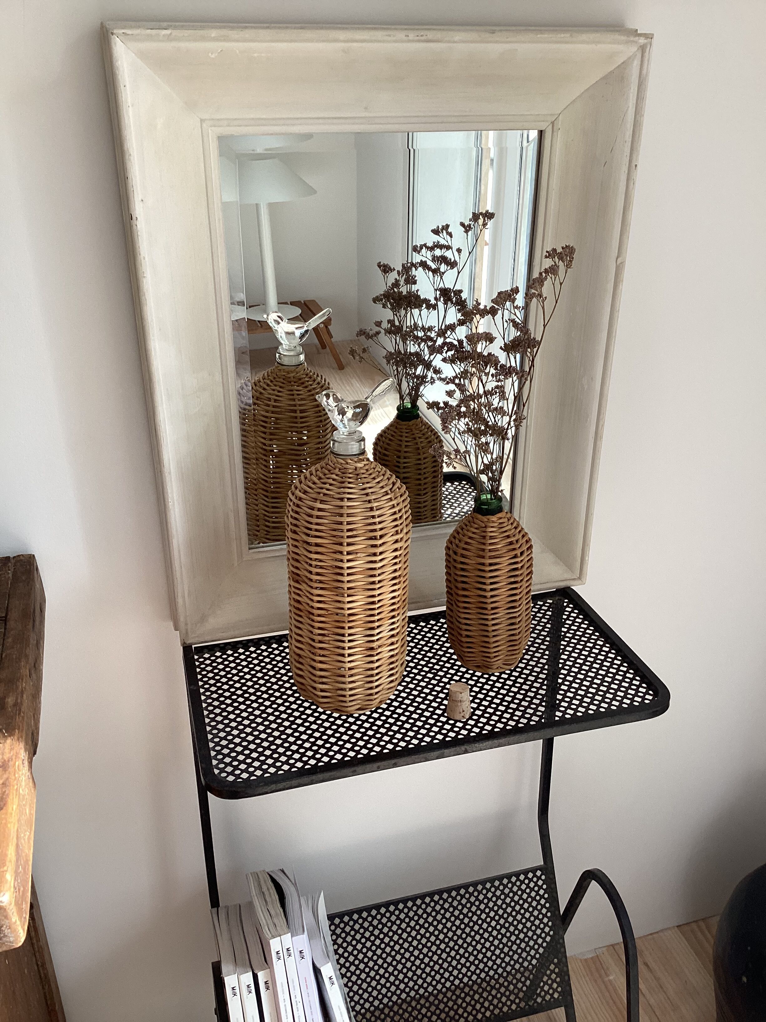 2 glass and rattan bottles