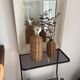 2 glass and rattan bottles