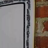Rearview mirror and screen-printed with gold outline and black edging