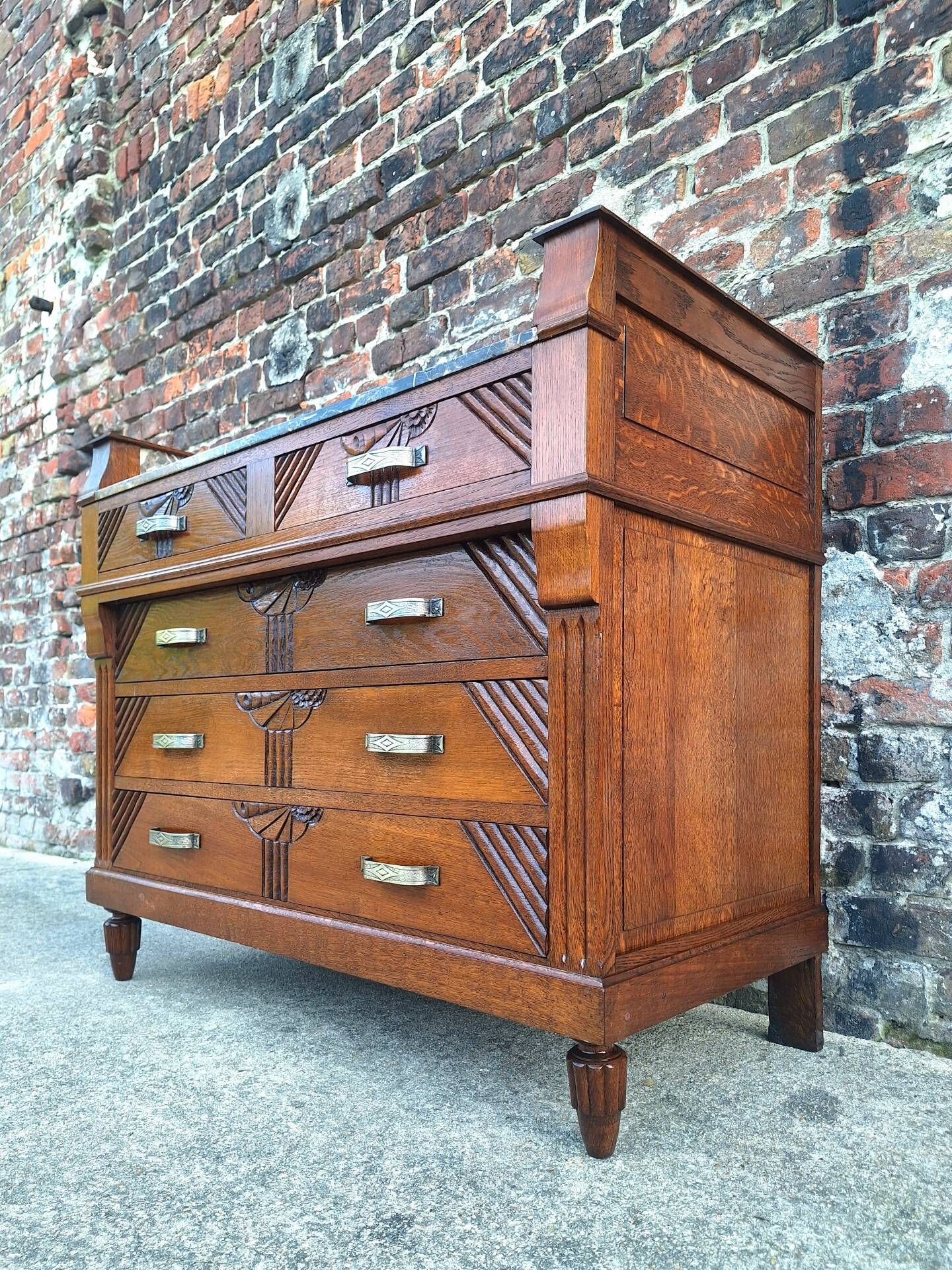 Art Deco commode with marble top, vintage antique furniture.
