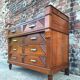 Art Deco commode with marble top, vintage antique furniture.