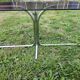 Vintage coffee table with metal tube structure and glass top.