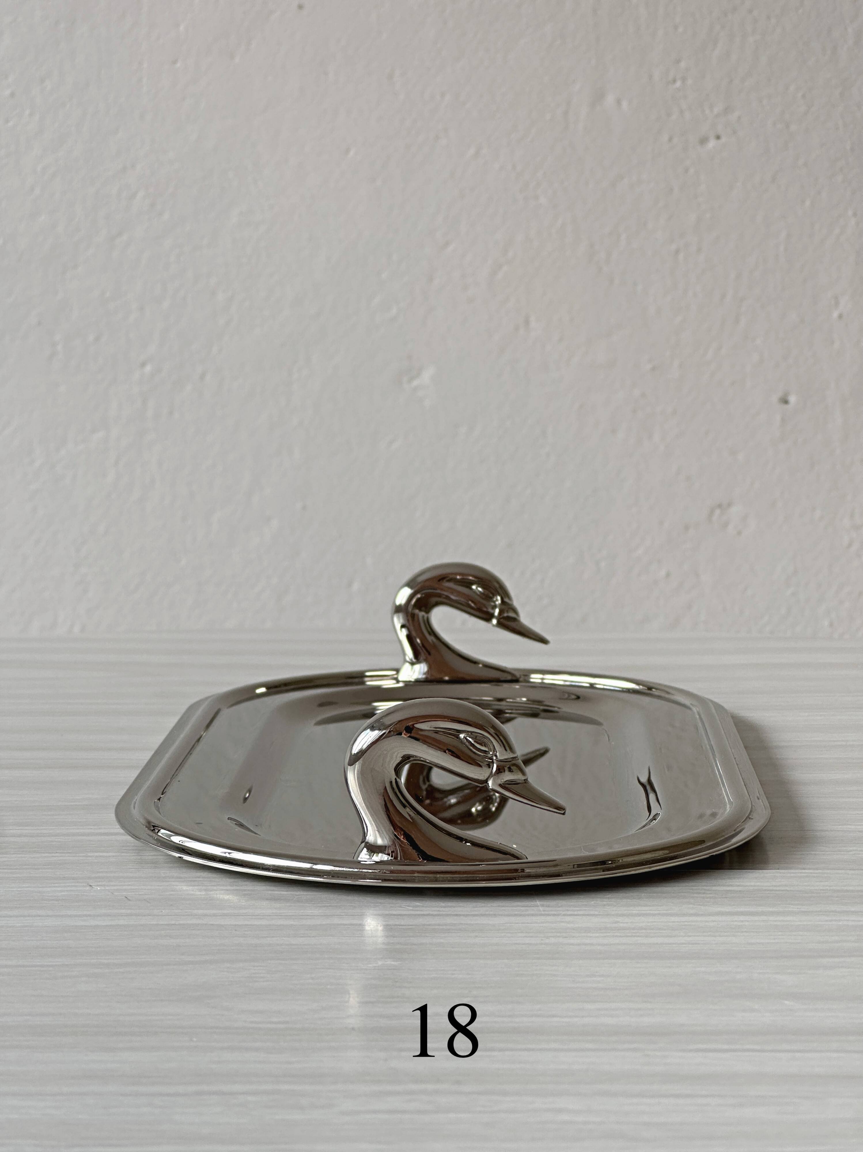 Metal dish with goose head handles serving tray