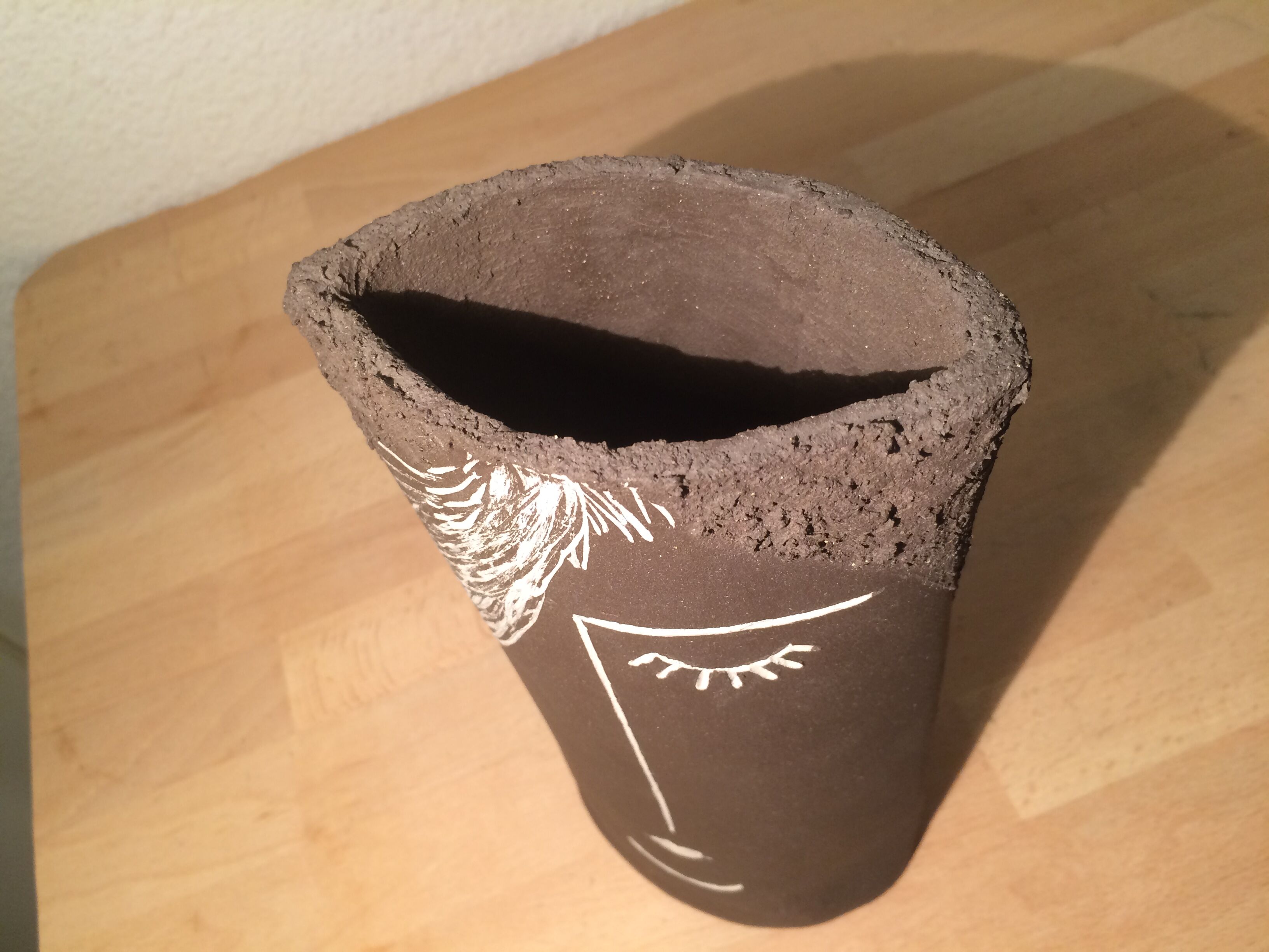 Ceramic vase face, black and white