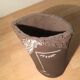 Ceramic vase face, black and white
