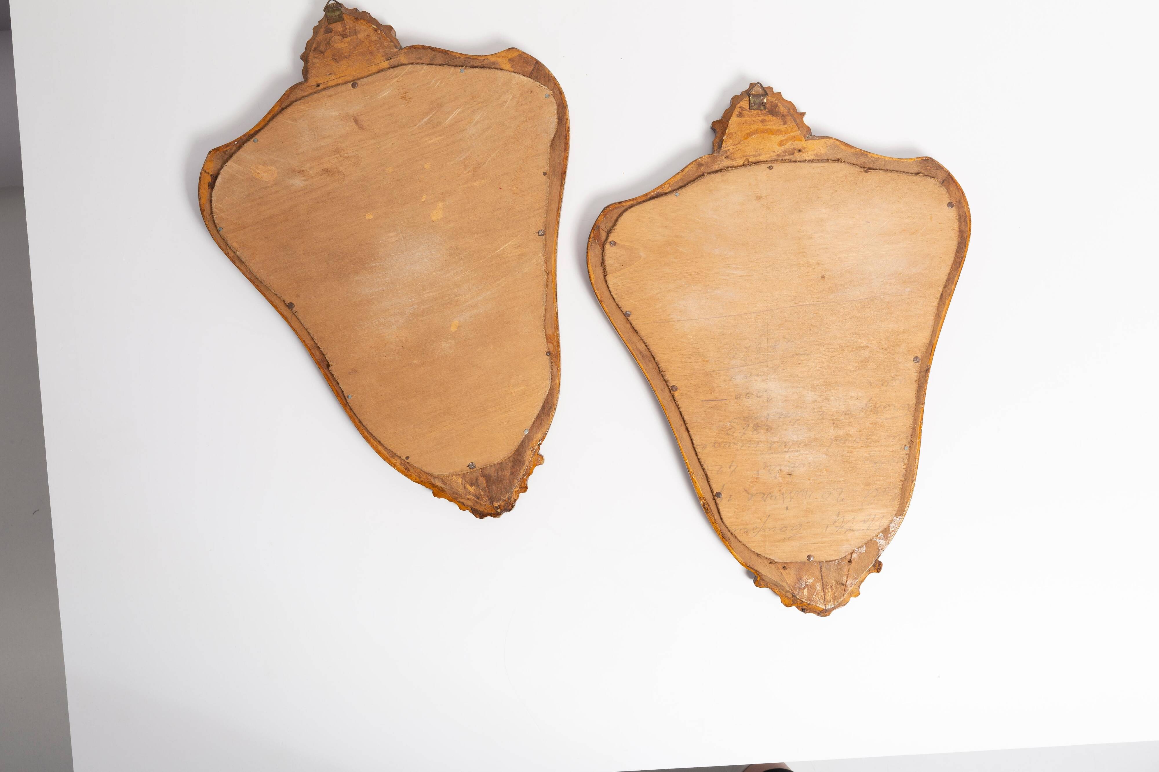 Pair of vintage Mid-Century decorative mirrors in a gold frame, Italy, 1960s.